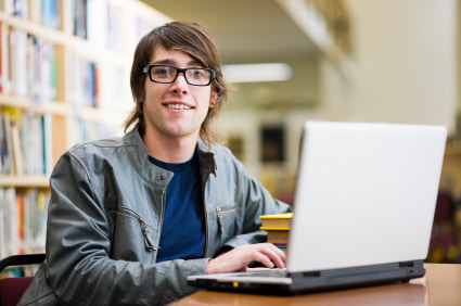 male-student-using-a-laptop